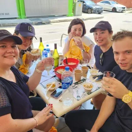 Employees celebrating the benefits of team building activities