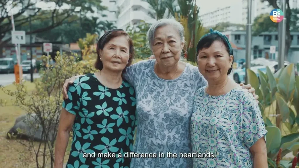 Employees engaged in an outdoor team-building exercise, emphasizing trust and communication in a lush Singaporean environment